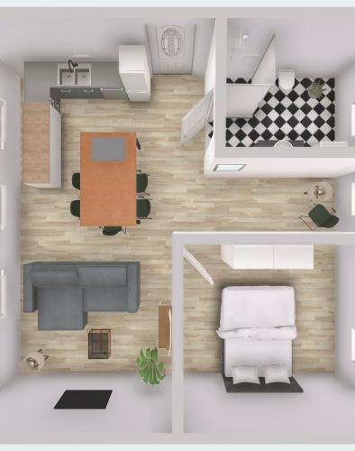a floor plan of a bedroom and a living room at Ferienwohnung Südtondern in Uphusum