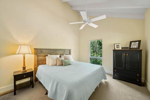 a bedroom with a bed with a ceiling fan at Banner Elk Valley Overlook in Banner Elk