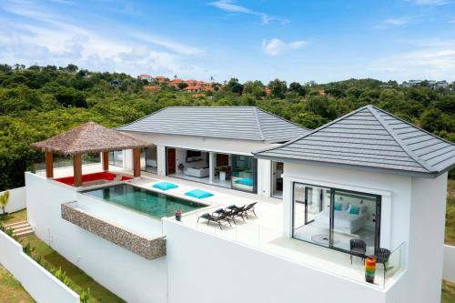 an aerial view of a house with a swimming pool at Villa Nirvana by SP Villa Management in Koh Samui
