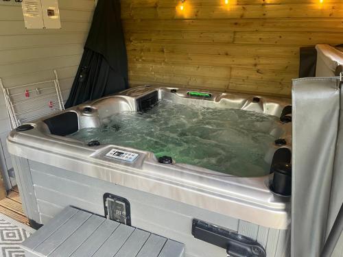 a large jacuzzi tub in a tent at Le petit Chalet in Port-Bail-sur-Mer