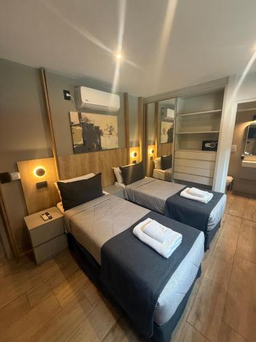 Postel nebo postele na pokoji v ubytování Nuevo Centro Hotel Mendoza