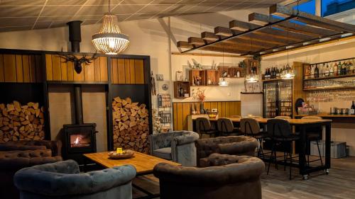 El lounge o bar de 11Stedenhuis