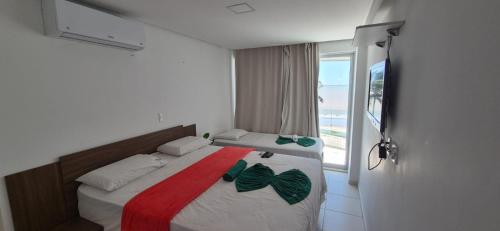 Postel nebo postele na pokoji v ubytování Apartamento 303 - Terrazzas Flat