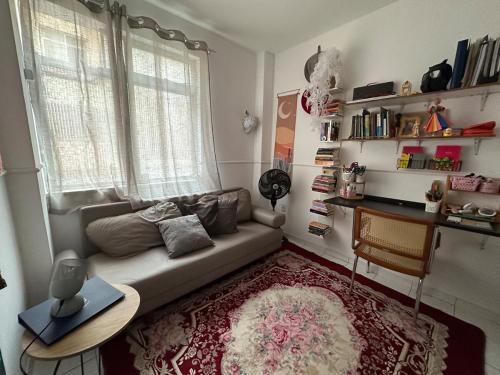 a living room with a couch and a table at A breath of fresh air in Belém in Belém