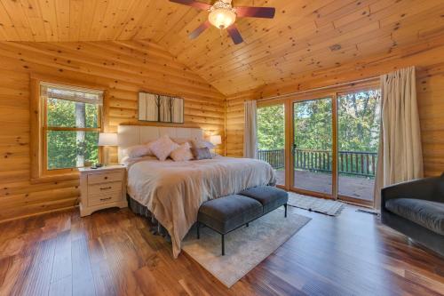 a bedroom with a bed in a log cabin at Luxury Cabin in The Reserve at Boyne Mountain in Boyne Falls