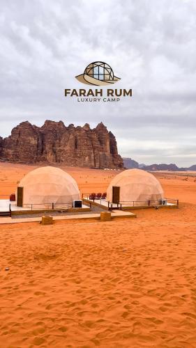 two domes in the middle of a desert at FARAH RUM LUXURY CAMP & Bubbles Hotel in Wadi Rum