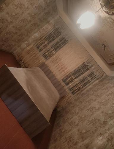 a rug on the floor in a room with a ceiling at Гостевой дом Туманян in Tʼumanyan