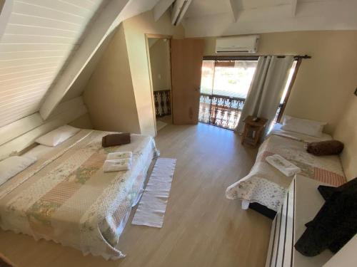 Imagem da galeria de Pousada Reserva do Tombo Lounge Hostel no Guarujá