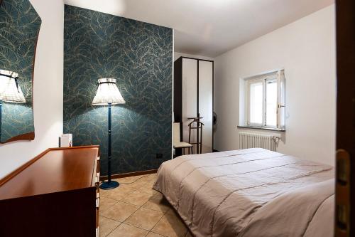 Postel nebo postele na pokoji v ubytování Casa Turbigo-Malpensa-Milano