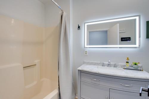 a bathroom with a sink and a mirror and a tub at Peaceful Country Apt Extended Stays Welcome! in Pataskala