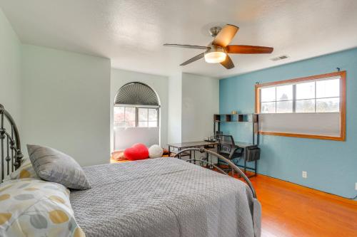 a bedroom with a bed and a ceiling fan at 3 Mi to Sequoia Park Zoo Spacious Home with Sunroom in Rosewood