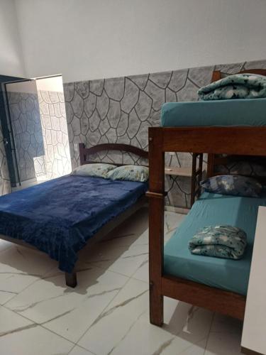 Postel nebo postele na pokoji v ubytování Casa em Furnas - Capitólio 100Mts da Água