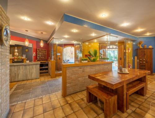 a kitchen with a wooden table in a room at Hotel Benedetti in Campello sul Clitunno