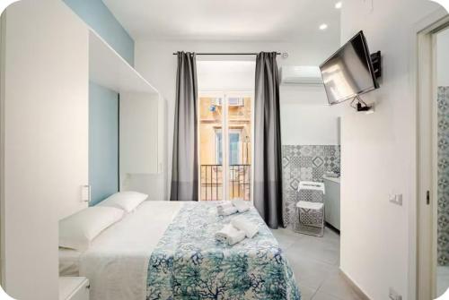 Ένα ή περισσότερα κρεβάτια σε δωμάτιο στο Duomo 34 Guest Room