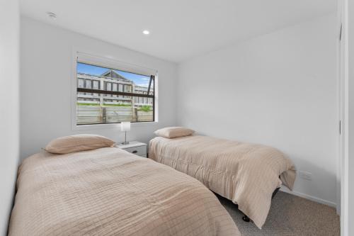 Voodi või voodid majutusasutuse Wharewaka Vista - Taupo Holiday Home toas