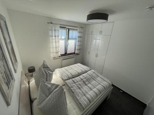 Postel nebo postele na pokoji v ubytování Haus Zur See - Wohnung 1 - Gruzdz