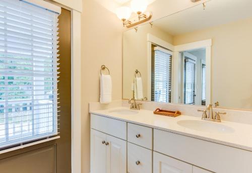 a bathroom with two sinks and a large mirror at 404B The Princess Anne House in Virginia Beach