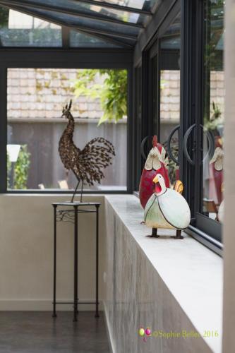 two stuffed chickens and a bird on a counter at L'Hostellerie d'Acquigny in Acquigny
