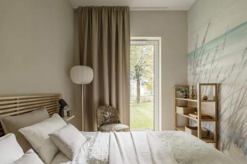 Ένα ή περισσότερα κρεβάτια σε δωμάτιο στο HYGGE Golf House