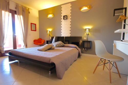 a bedroom with a large bed in a room at Park 20 Guesthouse in Olbia