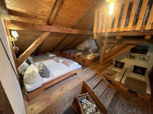 an overhead view of a bedroom in a log cabin at Evelyn's Hütte in Schwarzenberg im Bregenzerwald