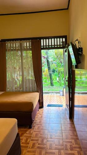 Postel nebo postele na pokoji v ubytování Rani Homestay