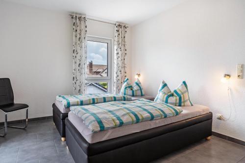 Postel nebo postele na pokoji v ubytování Ferienvilla Kapitänshaus