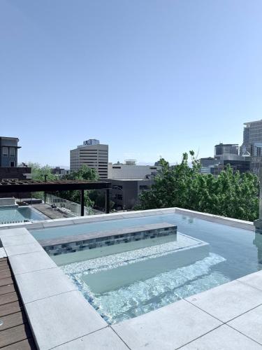 a swimming pool on top of a building at Modern Downtown SLC in Salt Lake City