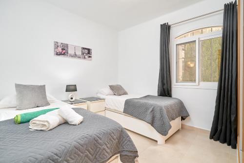 Ένα ή περισσότερα κρεβάτια σε δωμάτιο στο Apartamento Ella