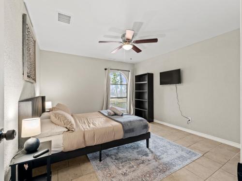 a bedroom with a bed and a ceiling fan at 4brping Pong2500 Sq Ft in Bedford