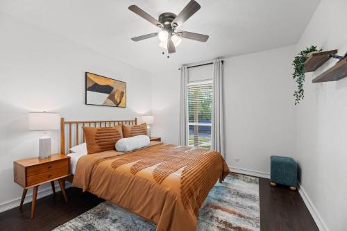 a bedroom with a bed and a ceiling fan at Palm Springs Pool & Game Room! in The Colony