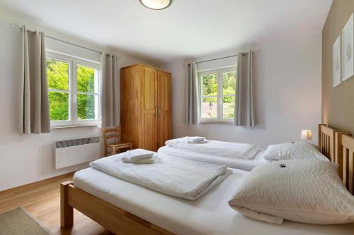 Ένα ή περισσότερα κρεβάτια σε δωμάτιο στο Ferienhaus 1 - Wohnung Tanne, 78qm