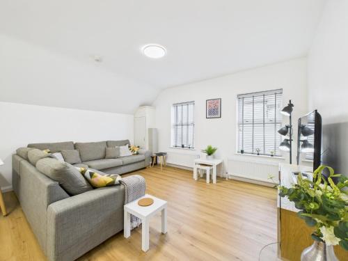 a living room with a couch and a table at Kings Corner in Warrenpoint