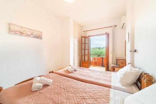 Postel nebo postele na pokoji v ubytování Arianna Studio Ground Floor 1