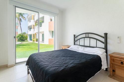 Llit o llits en una habitació de Puerta Laguna E002