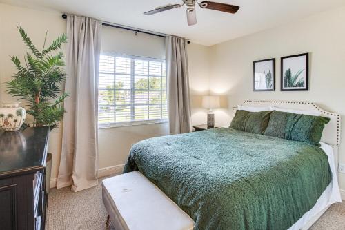 a bedroom with a bed and a window at Golf Getaway Cape Coral Condo 1 Mi to River! in Cape Coral Hospital Heliport