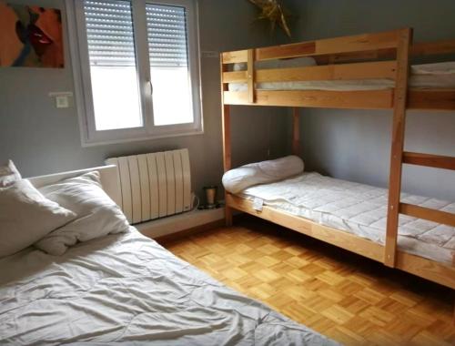 Postel nebo postele na pokoji v ubytování le coin du bois en Touraine