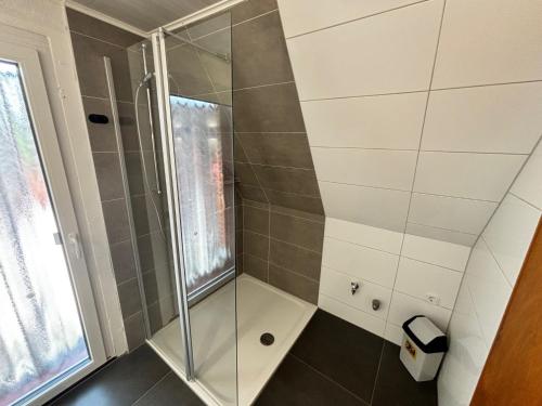 a shower with a glass door in a bathroom at Ferienwohnung Anne in Bremervörde