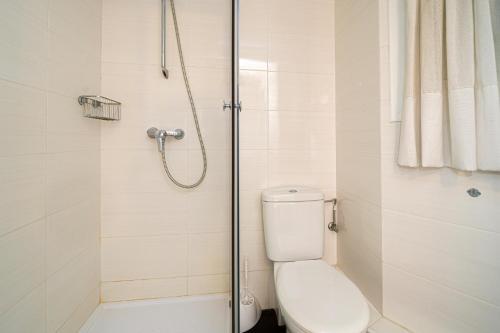 a bathroom with a toilet and a shower at Wg1 Benidorm in Benidorm