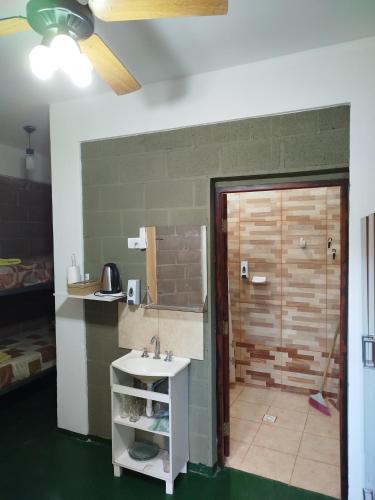 a bathroom with a sink and a shower at Habitación para 3 in Belén