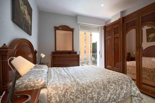 Postel nebo postele na pokoji v ubytování Apartamento Aeropuerto Sevilla
