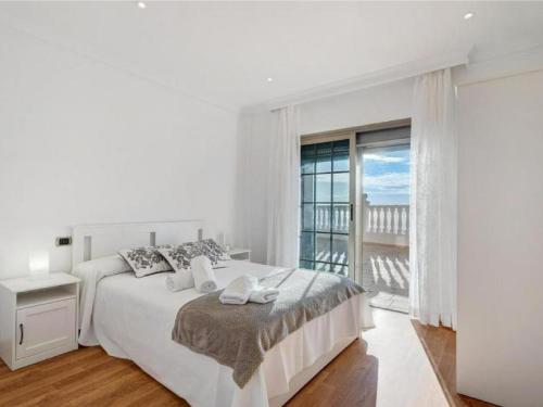 Giường trong phòng chung tại Karat Villa Horizonte