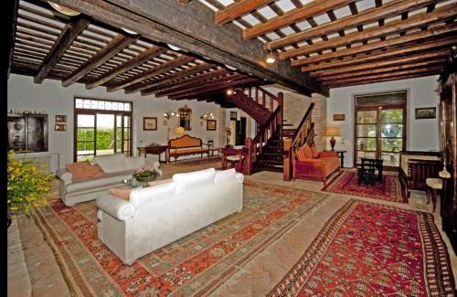 a living room with a white couch and a rug at Italian Experience-Villa Incanto in Potenza Picena
