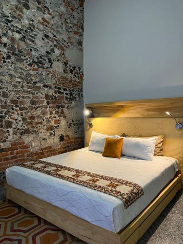 Postel nebo postele na pokoji v ubytování Chilango BnB