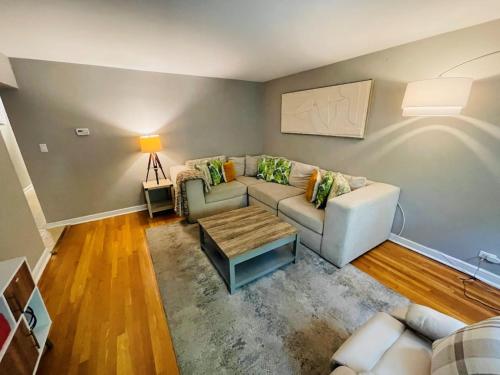 a living room with a couch and a table at Apartment Home close to NWU & Hospitals in Evanston