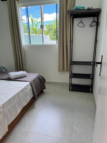 Ένα ή περισσότερα κρεβάτια σε δωμάτιο στο Casa praia pontal próx embarque ilha do mel