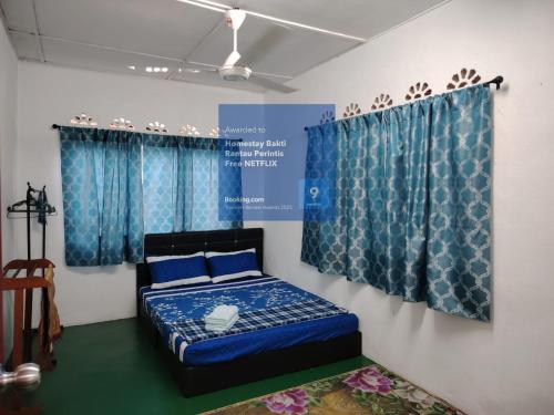 Postel nebo postele na pokoji v ubytování Homestay Bakti