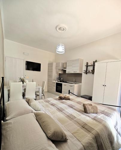 a large bedroom with two beds and a kitchen at Da Nonno Mario in Bagnoli Irpino