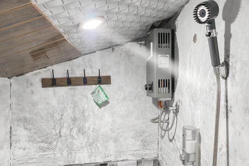 a bathroom with a shower in a wall at Merapi Hill Homestay Syariah Selo RedPartner in Selo