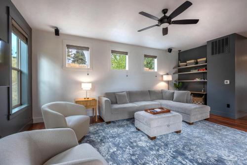 a living room with a couch and a ceiling fan at Evergreen Retreat AB 30 Night Minimum home in White Salmon
